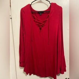 Woman’s plus size top in Red size 3X with bell sleeves.